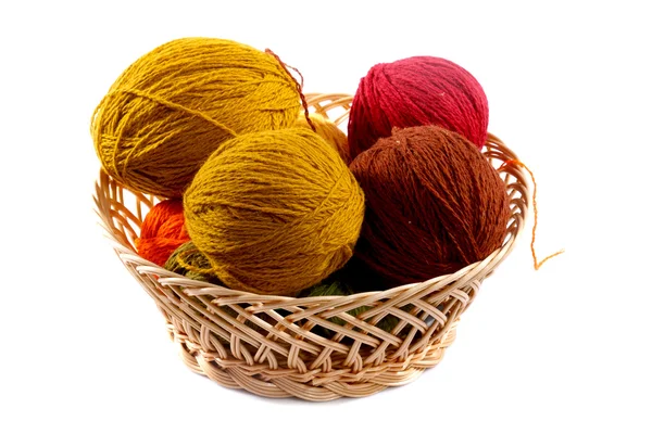 Colored wool balls in wicker basket — Stock Photo, Image