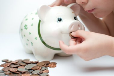 Kid with a piggy bank clipart