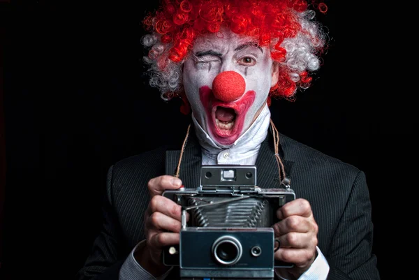 Instant-Kamera-Clown lizenzfreie Stockfotos