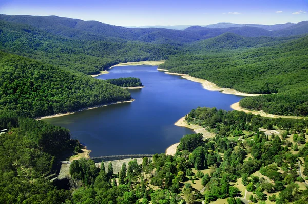 stock image Aerial photo of dam in between mountains