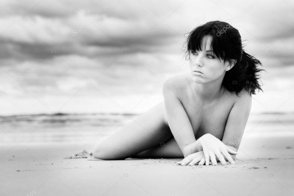 Beautiful girl laying on beach