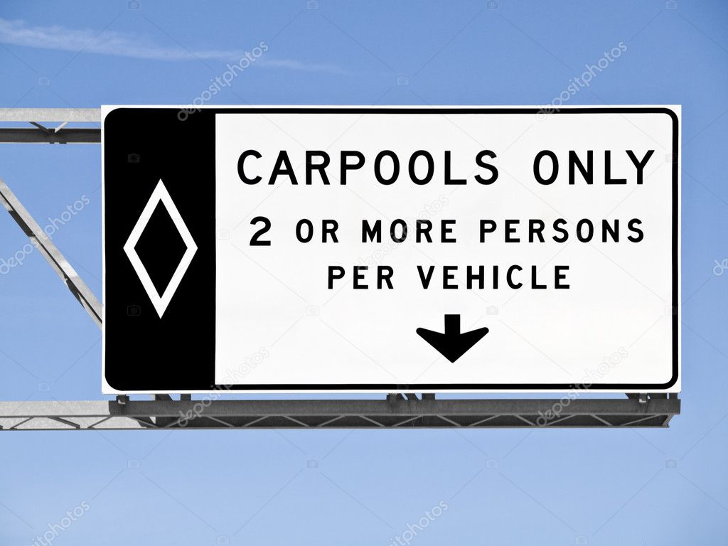 Overhead Freeway Carpool Only Sign With Blue Sky