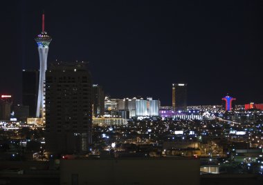 Stratosphere, Circus Circus and other Vegas resorts at night. clipart