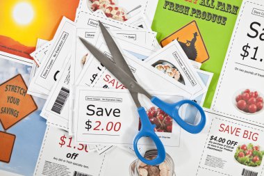 Fake coupons on a fake coupon background with scissors. clipart