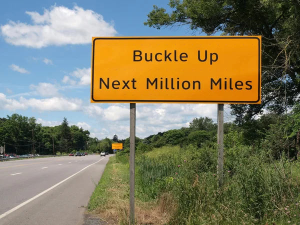 Buckle Up Sign and Highway