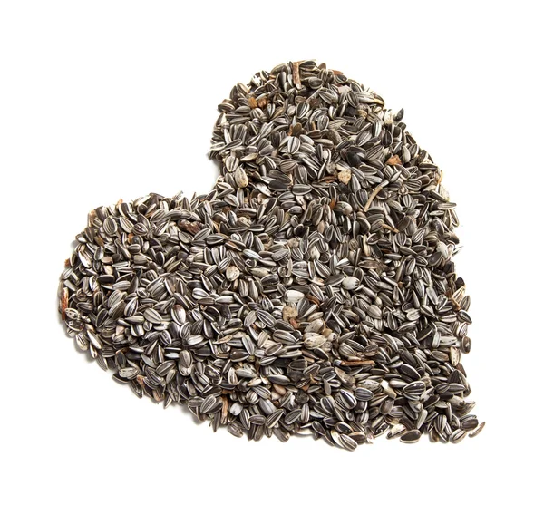 Sfondo semi di girasole a forma di cuore . — Foto Stock