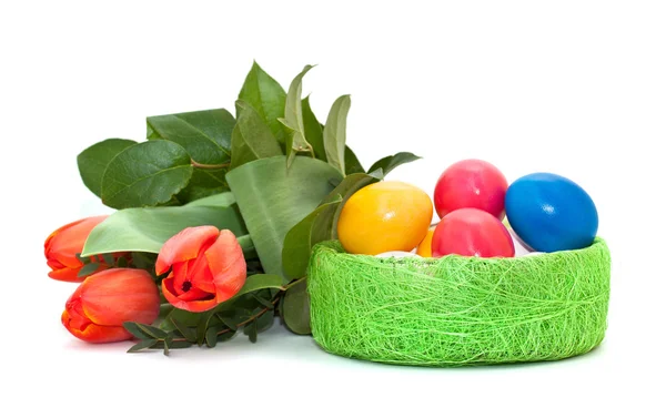 Easter eggs with a bouquet of tulips — Stock Photo, Image