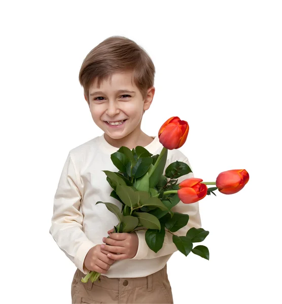 Мальчик с букетом цветов на белом фоне . — стоковое фото