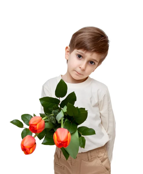Boy with a bouquet of flowers isolated on white background. — Stock Photo, Image
