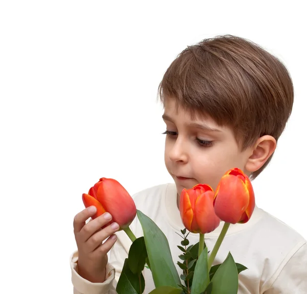 Хлопчик з букетом квітів ізольований на білому тлі . — стокове фото