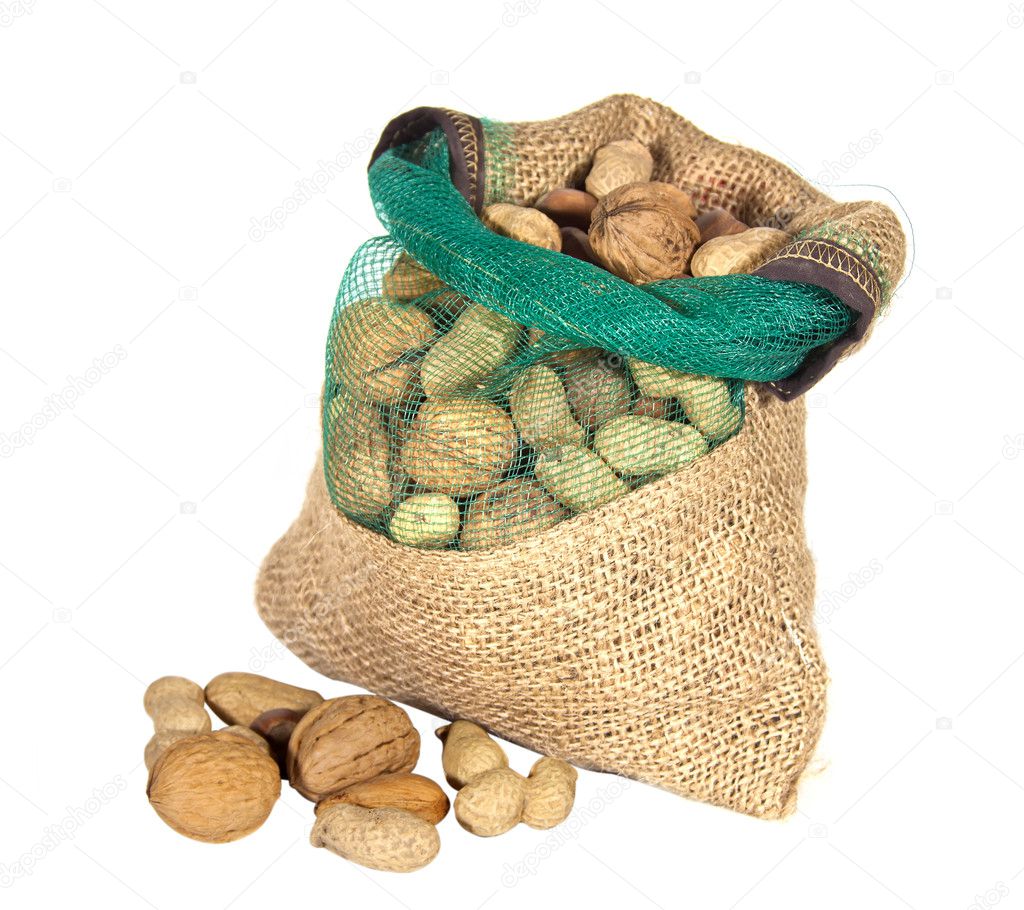 Stock photography ▻ Mixture of nuts in a sack and isolated white background...