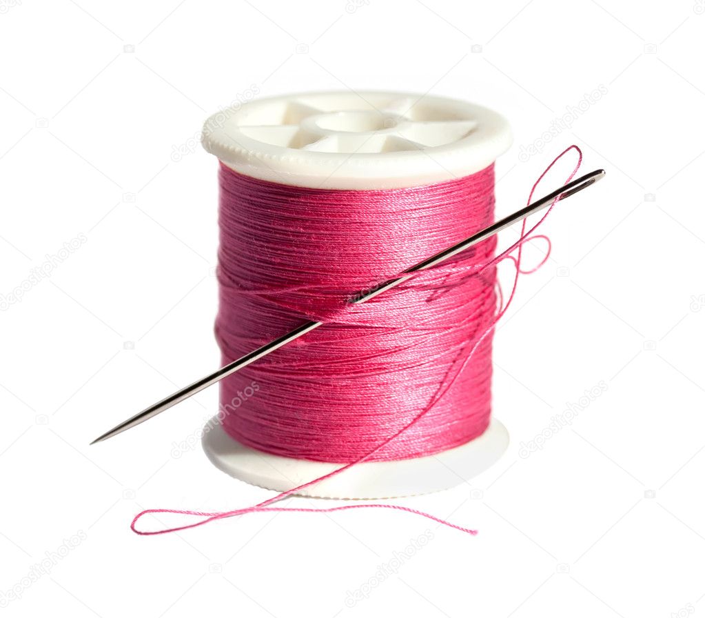 Spool of thread with a needle on a white background Stock Photo by ...