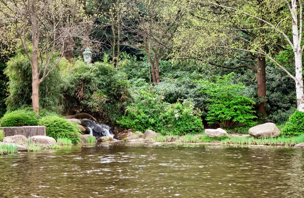 stock image Waterfall and lake in the woods