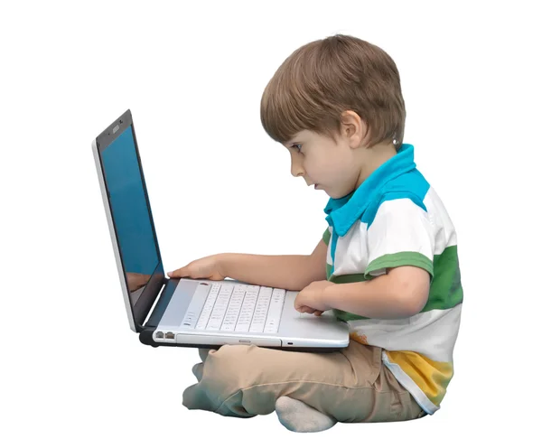 Chlapec s notebookem izolované na bílém pozadí — Stock fotografie