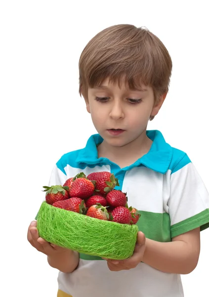 Portrait of a boy with a bowl of strawberries in the hands isolated on whit — Stock Photo, Image