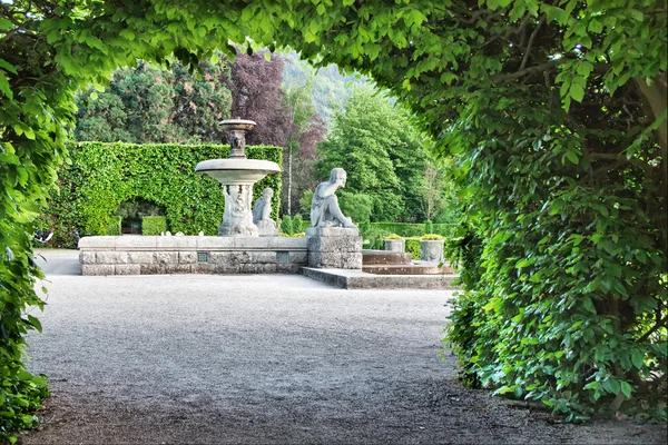 A fountain in the park of roses. Germany, Baden-Baden. — Stock Photo, Image