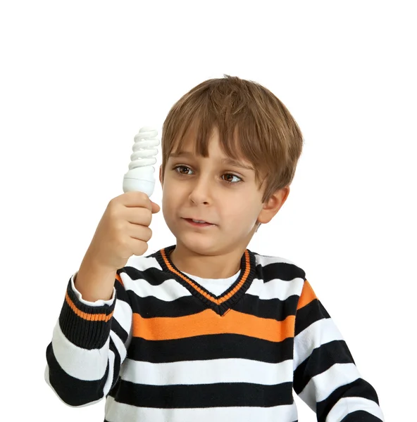 Мальчик держит лампу, изолированные на белом фоне — стоковое фото