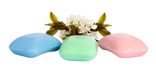 The pieces of soap with a sprig of cherry blossoms. — Stock Photo, Image