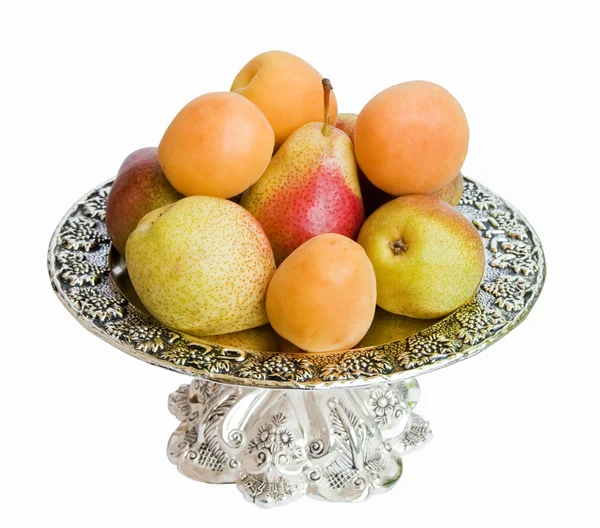 O prato com fruto isolado em um fundo branco . — Fotografia de Stock