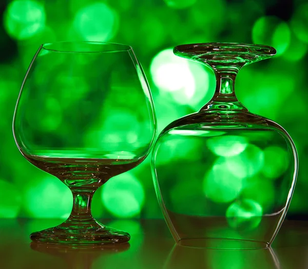 Beautiful glasses for wine against green a side — Stock Photo, Image