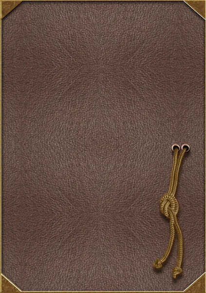 La textura de la piel con letras de oro y una cuerda atada en un — Foto de Stock