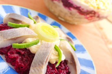 Traditional herring salad with beetroots clipart