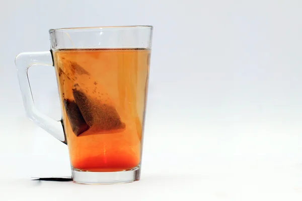 Tea poured into cup — Stock Photo, Image