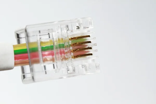 stock image Telephone wire with connector isolated on the white background