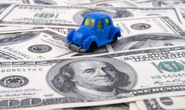 Toy car on money background — Stock Photo, Image