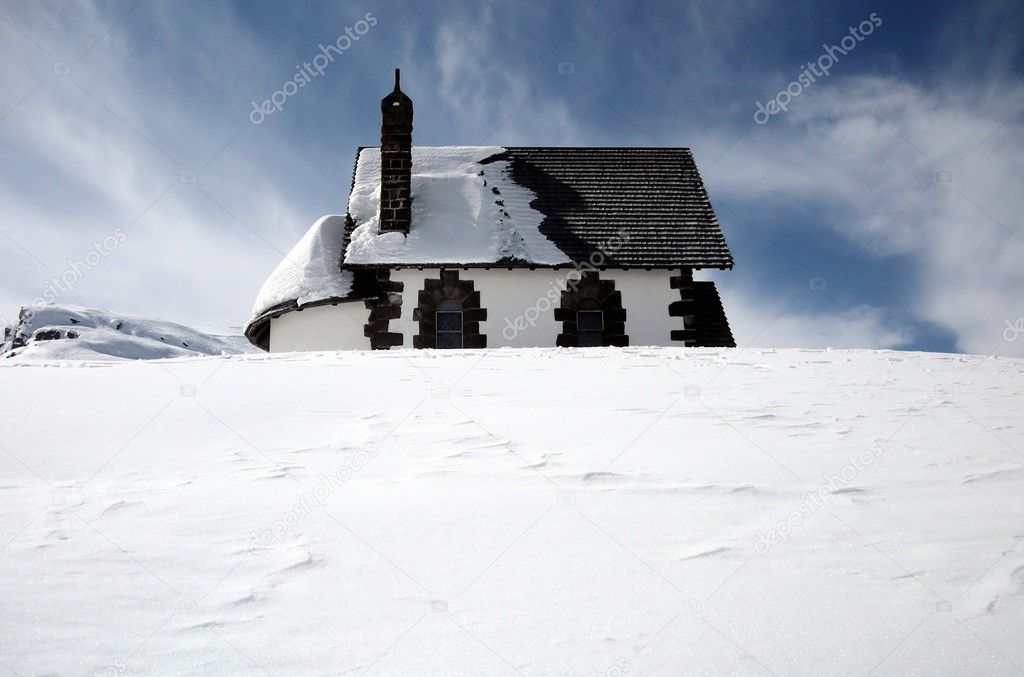 Cottage in white snow
