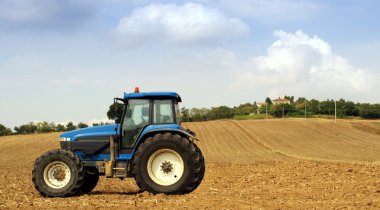 Tractor in a field clipart