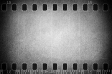 Grunge scratched film strip background clipart