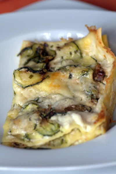 stock image A slice of zucchini quiche