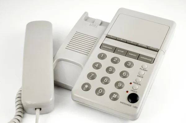 Telefone moderno branco com auscultador levantado — Fotografia de Stock