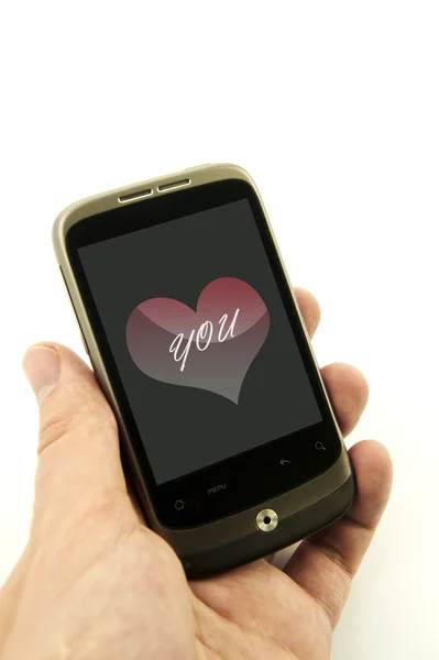 Мобільний телефон з валентинковою карткою — стокове фото