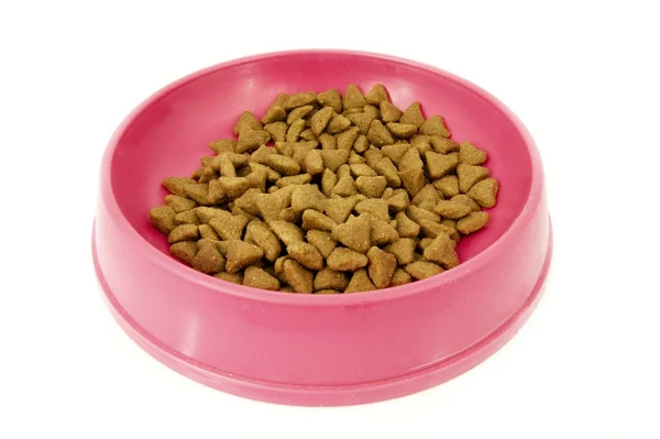 Stock image Dry cat food in pink bowl isolated on white