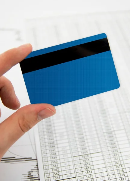 Credit card in hand on business background — Stock Photo, Image
