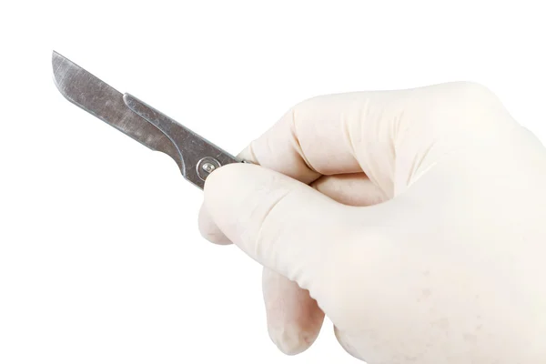 Hand met scalpel — Stockfoto