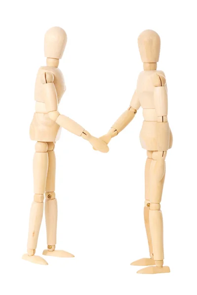 stock image Wooden dolls handshake