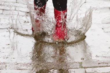 Gum boots in the rain clipart