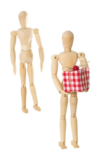 Wooden dolls with present — Stock Photo, Image