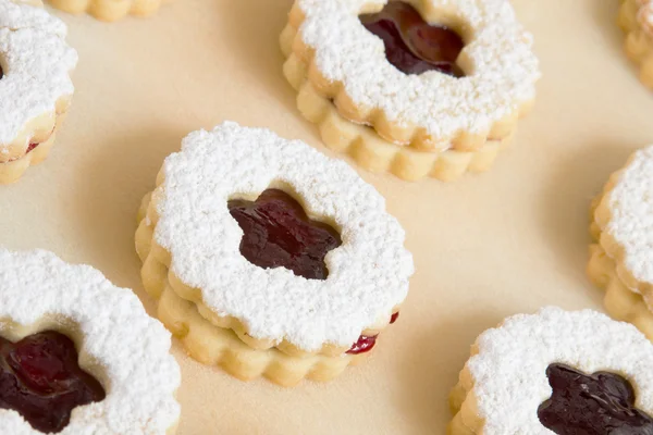 Decorated cookies on baking paper — Stock Photo, Image