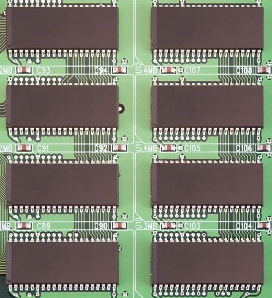 Board with conducting paths and computer chips