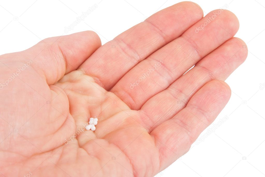 Homeopathic globules in hand