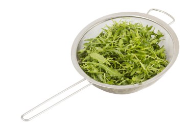 Arugula in colander