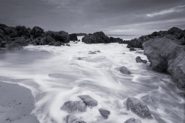 Beach of Liencres in black and white, Cantabria, Spain clipart