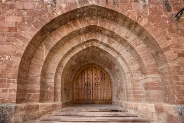 Gate of the monastery of Valvanera, La Rioja, Spain clipart