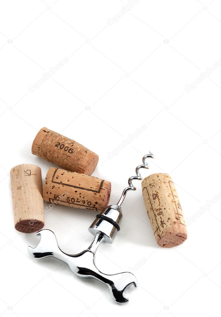 Corks and corkscrew over white