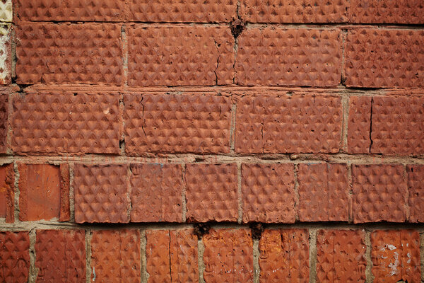 Background of rough dirty red brick wall texture.