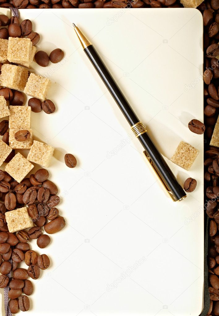 Coffee beans, paper, pen